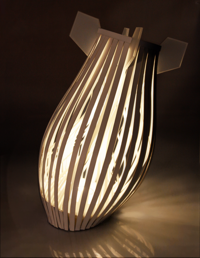 Illuminated Peacebomb table lamp seen from a low angle
