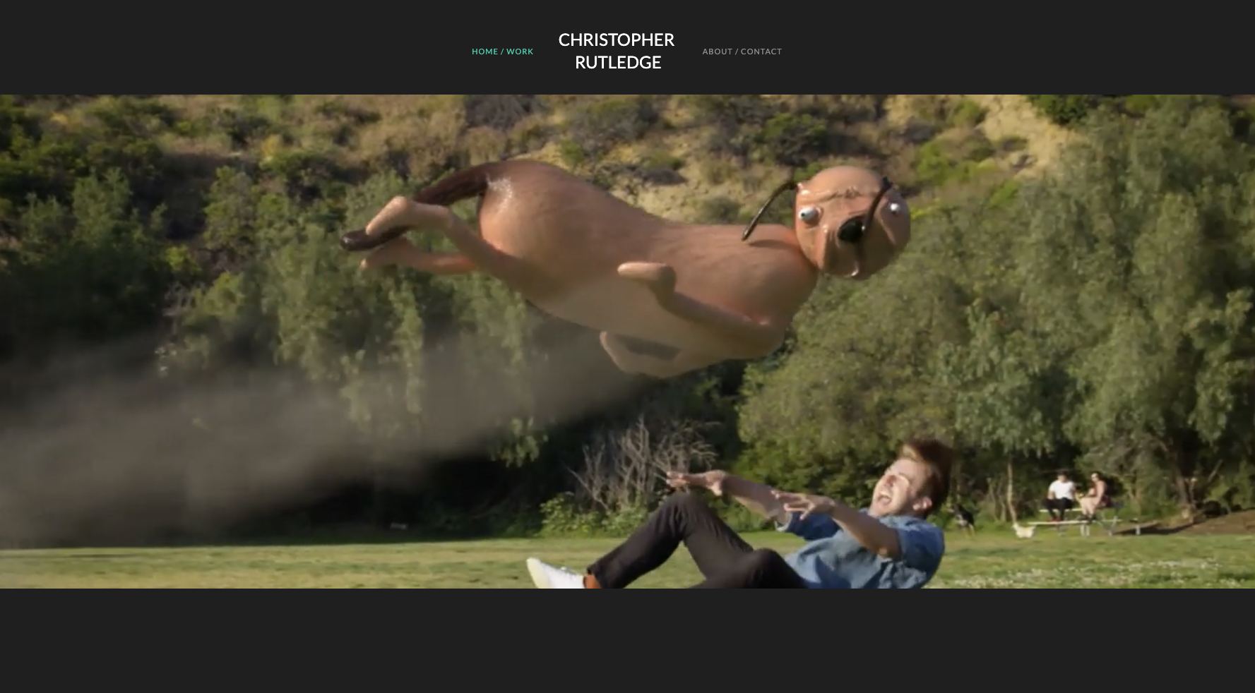 A CG scene from Christopher Rutledge's work: an inflated creature with headphones floating above a startled man in a sunlit park