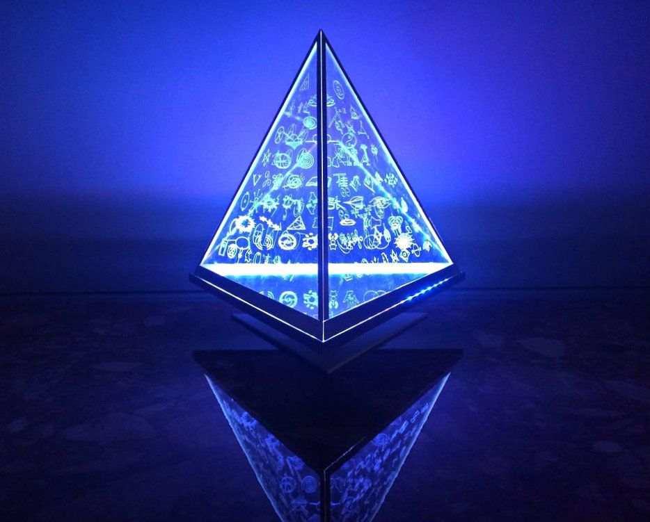 Blue illuminated Symbol Lamp reflected on a dark surface