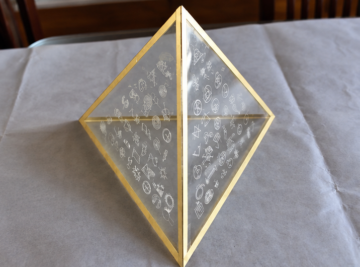 Unlit triangular Symbol Lamp structure during fabrication