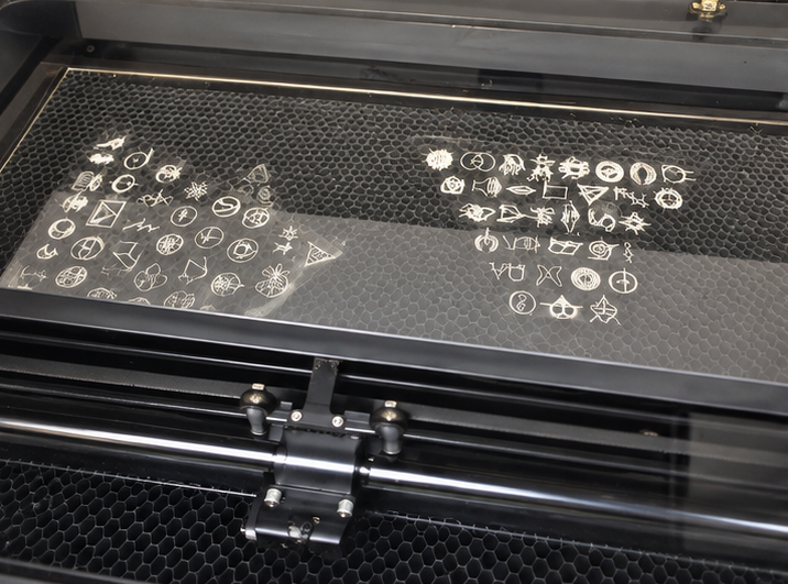 Transparent panels with symbols inside a laser engraving machine